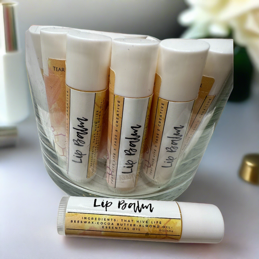 Glass jar of lip balm sticks